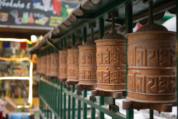 Row of buddhist prayer wheels
