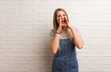 Young russian hipster woman shouting something happy to the front