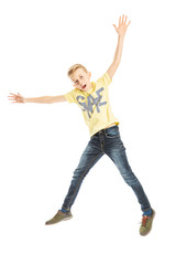 Teen boy jumping. Vertical. Isolated on a white background.