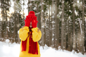Beautiful young woman in winter forest