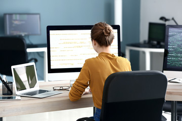 Female programmer working in office