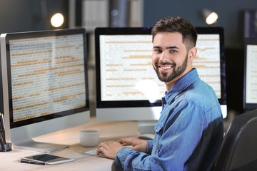 Obraz na płótnie Canvas Male programmer working in office