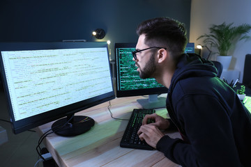 Male programmer working in office