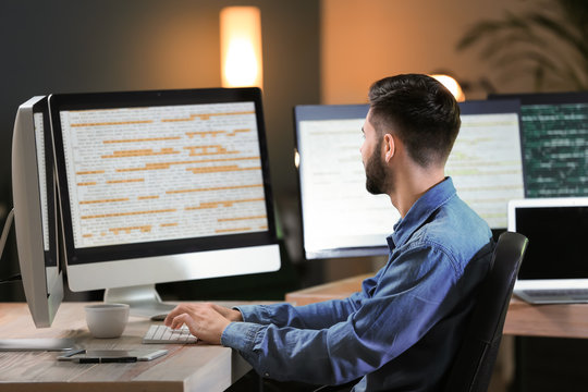 Male programmer working in office