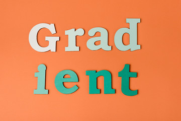 top view of colorful letters on orange surface