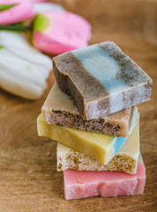 colorful natural handmade soaps on wooden background