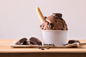 Choco ice cream cup decorated with chips and waffle