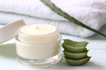 cream with aloe vera on a light background. Aloe vera skin care. Moisturizing and skin care.