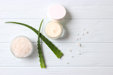 Fototapeta na wymiar cream with aloe vera on a light background. Aloe vera skin care. Moisturizing and skin care.