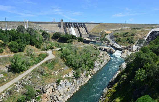 Folsom Dam In California With A Sluice Gaten Open..