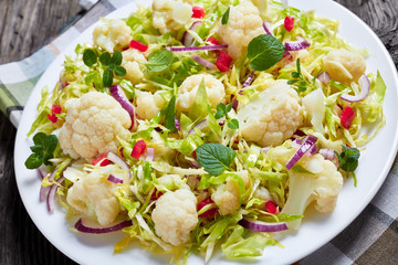 healthy cauliflower salad on a white plate