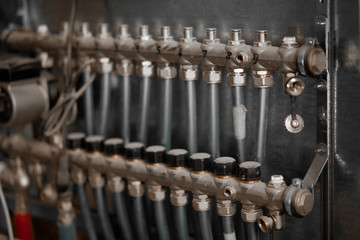 Supply and return lines of the collector for the warm floor. Selective focus, closeup view