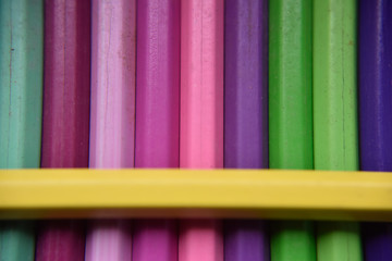 Different pencils under the yellow pencil