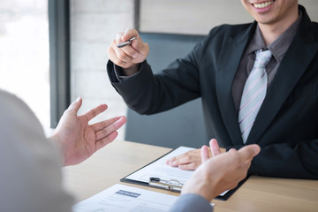 Employer arriving for a job interview, businessman listen to candidate answers explaining about his profile and colloquy dream job, manager sitting in job Interview talking in office