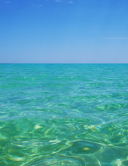 Transparent clean sunny ocean sea water waves for background and texture.