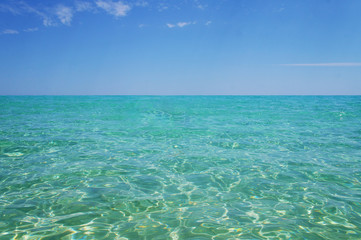 Transparent clean sunny ocean sea water waves for background and texture.