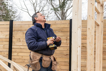 carpenter working on wood structure