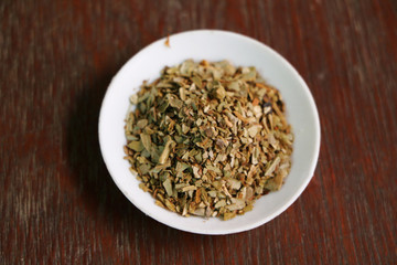 Dried Oregano on Wooden Background