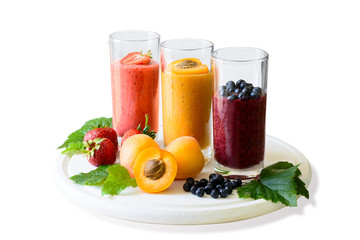 Isolated strawberry, blueberry and apricot smoothies. Detox and healthy eating concept