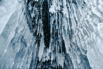 Ice caves with frozen water on Lake Baikal, Russia