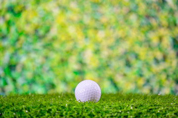 Golf ball on tree for golfer hitting on tee off zone on blurred background