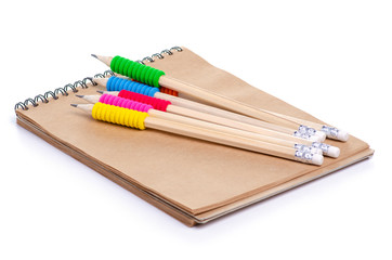 Fototapeta premium notepad and pencils on white background isolation