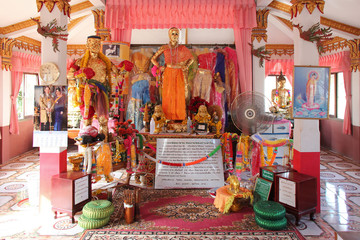 altar and statues of divinities in a buddhist temple (Wat Pa Mok) in Ang Thong (Thailand)