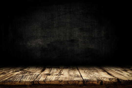 Dark desk background of free space for your decoration and black wall space 