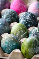 Boiled Easter eggs painted in the style of cosmos and a distant galaxy. Easter.