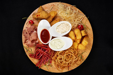 meat and snack set. pub, restaurant, bar food concept. meat appetizers set with grill chicken, sausages, tomatoes cherry, souses and fresh greens.