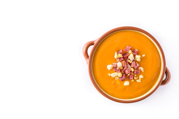 Typical Spanish salmorejo cream with ham and egg isolated on white background. Top view. Copyspace