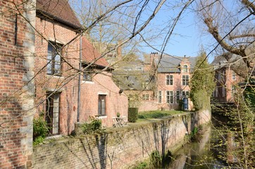 Brick houses along the canal in Leuven, Belgium