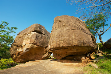Ancient monks meditation caves under big rocks in Anuradhapura, Sri Lanka. This caves were used for meditation purposes by the first Buddhist monks in Sri Lanka.
