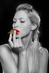 Girl eats strawberries