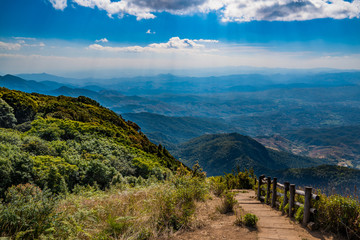 Scenic footpath across Doi Inthanon mountains with panoramic view of hills and valley landscape