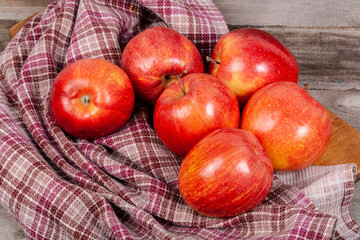 Fototapeta na wymiar A lot of apples on a wooden table
