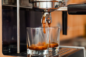 Close-up of espresso pouring from coffee machine