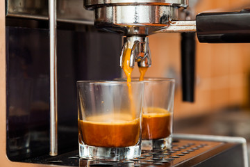 Close-up of espresso pouring from coffee machine