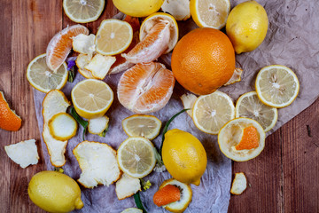 Fototapeta na wymiar A lot of lemons and oranges on a wooden table. Citrus theme