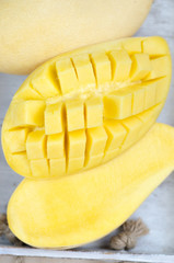 Mango on a wood box. Selective focus on the mangos slices