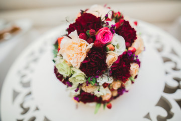 Beautiful wedding bouquet with different flowers, roses