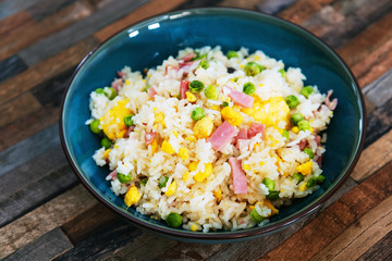 Homemade Chinese fried rice with vegetables and fried eggs