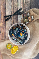 Mussel with white wine sauce on table