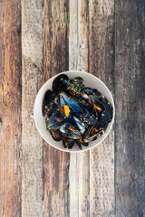 Mussel with white wine sauce on table