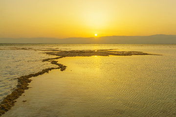 Sunrise and salt formations in the Dead Sea