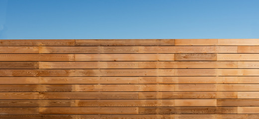 Wooden boundary fence around a property