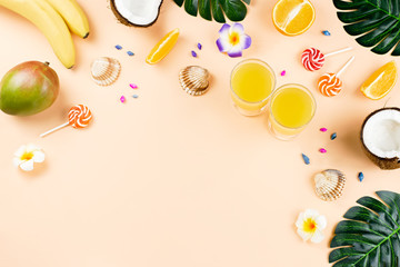 Summer tropical fruits frame on coral color background