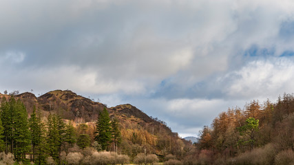 Stunning sunrise landscape image of Yew Tree Tarn in Lake District
