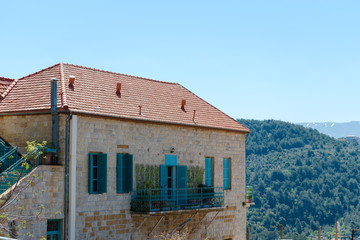 This is a capture of the old roads in Der El Kamar a village Located in Lebanon and you can see in the picture the old walk made of stones with an historic architecture for walls and houses 