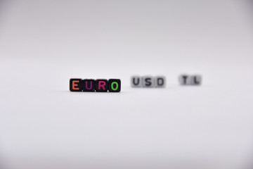 cube letters, euro - dollars- turkish liras lettering, colorful and varied, white background